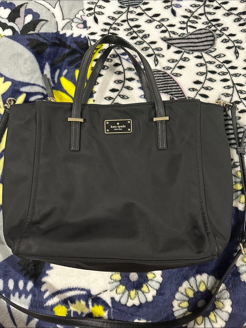 kate spade black nylon tote with gold-tone plaque